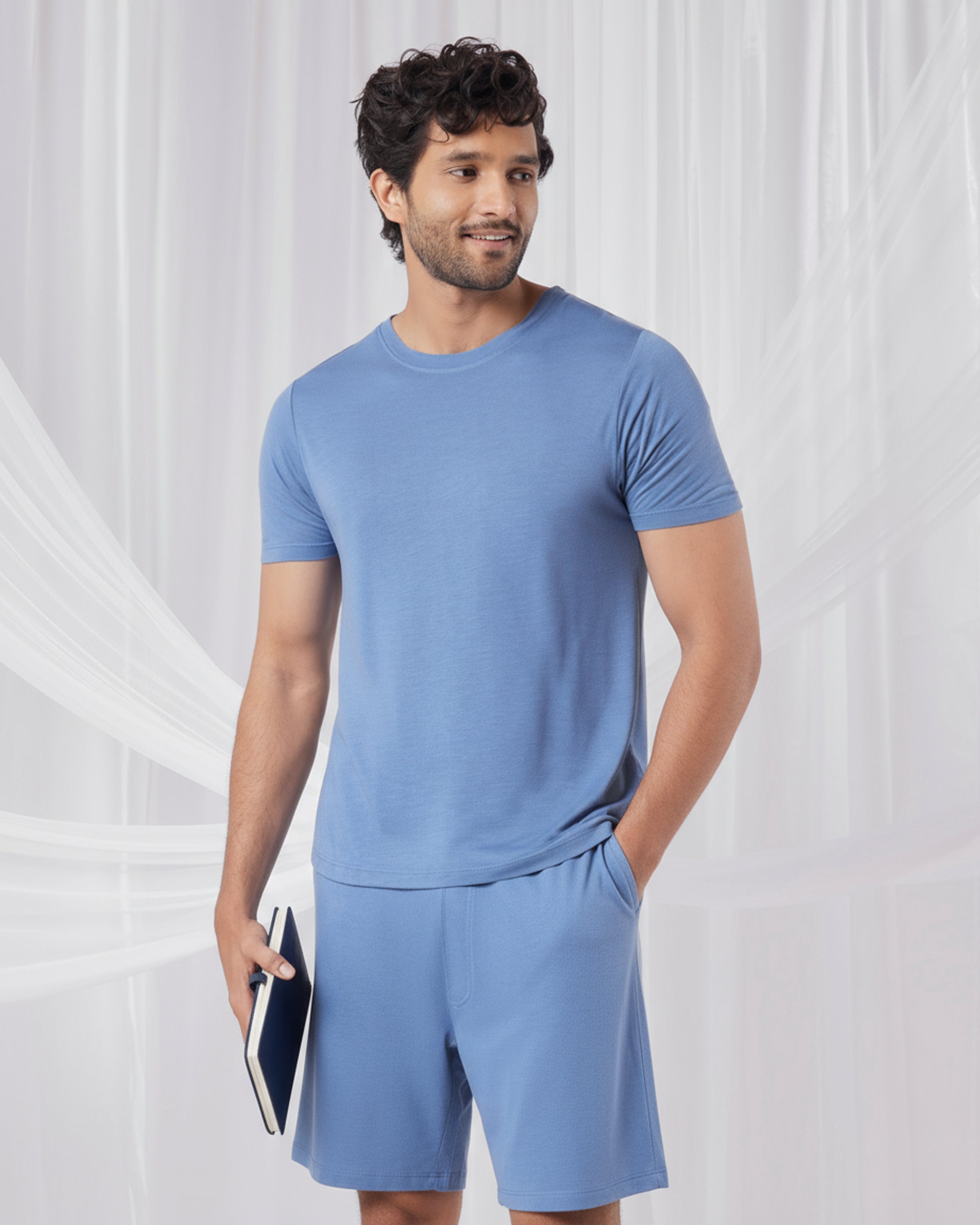 Man wearing a blue outfit standing against a white background
Cosmo T-Shirt + Shorts set in Serene Blue
Soft breathable fabric t-shirt and shorts
Women’s comfortable everyday lounge set
Eco friendly lightweight casual wear
Serene Blue cozy T-Shirt + Shorts set
Women’s Cosmo T-Shirt + Shorts Serene Blue
Smooth premium fabric soft touch set
Relaxed fit casual T-Shirt and shorts
Sustainable comfortable loungewear
Serene Blue two-piece set for women