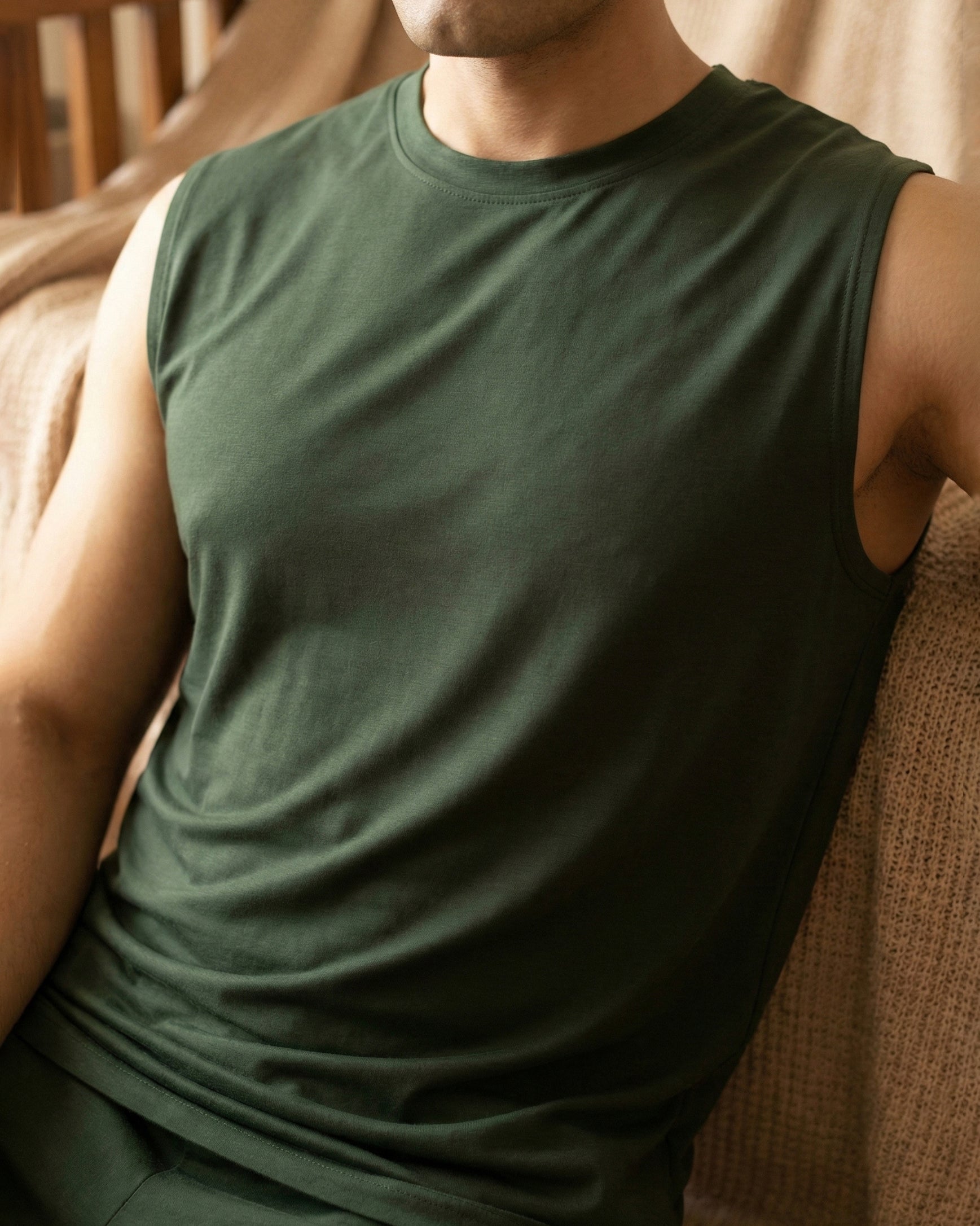 A dark green Softsleep bamboo cotton sleeveless tee designed for soft lounge comfort, breathable wear and relaxed movement.