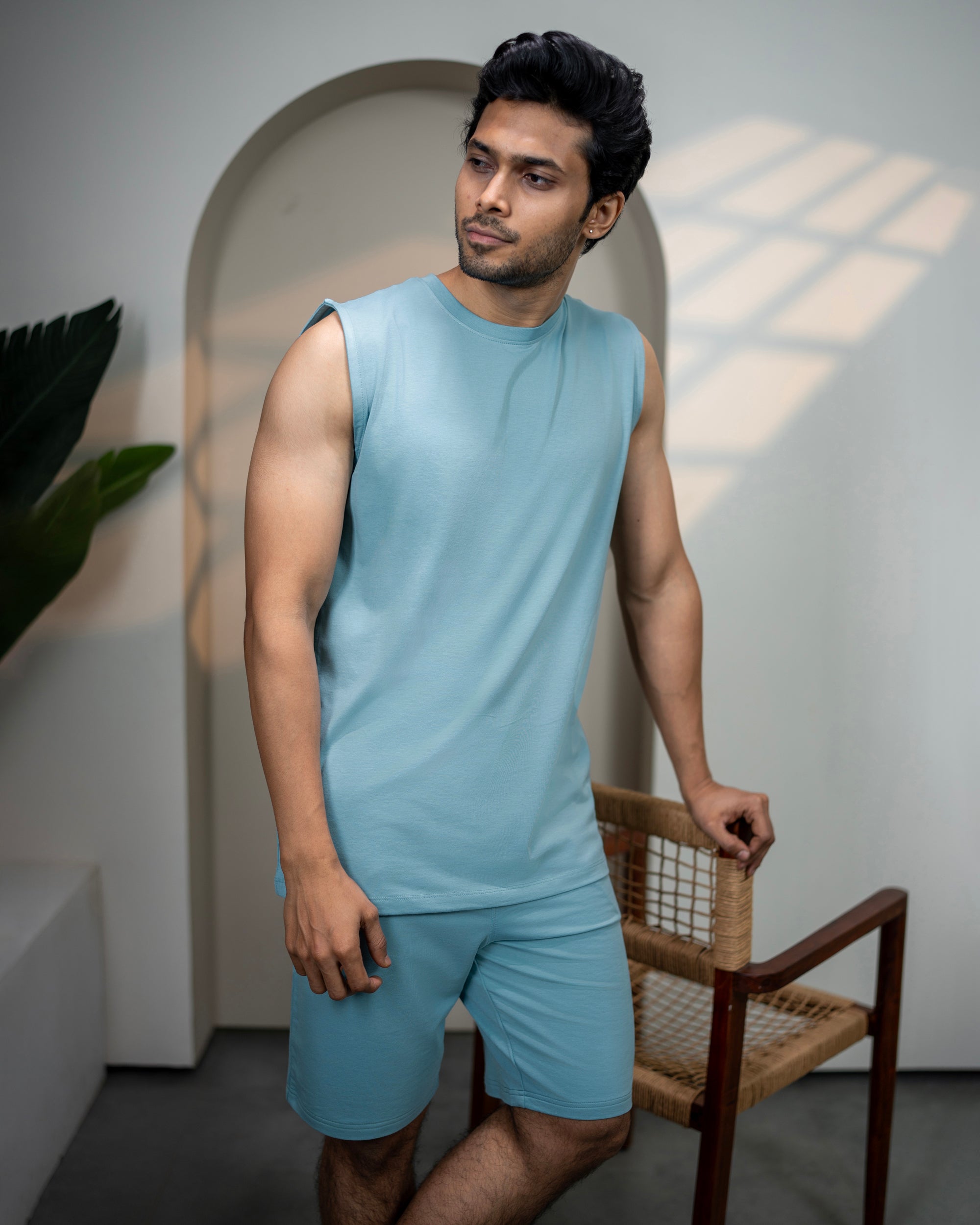 Man wearing a light blue sleeveless top and shorts standing indoors with a plant and chair in the background.
Hushy Bamboo Shorts in Nile Blue
Women’s comfortable casual shorts
Soft breathable bamboo fabric
Lightweight and smooth material
Relaxed fit for everyday wear
Nile Blue fresh vibrant shade
Eco friendly sustainable fabric
Perfect for lounging or daily wear
Minimalist versatile design
Wardrobe essential bamboo shorts
